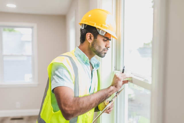 handyman fixing windows before house sale