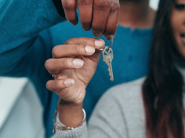 Copuple holding keys of their new home